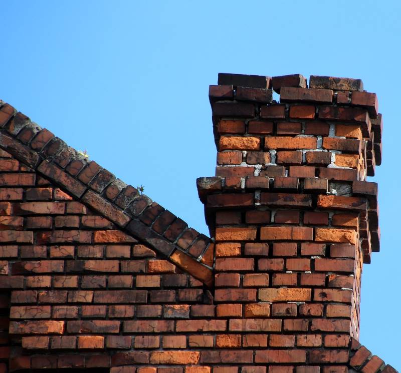 Signs Your Kendall Home Needs a Chimney Inspection Damaged chimney on an Kendall home showing cracks and missing mortar